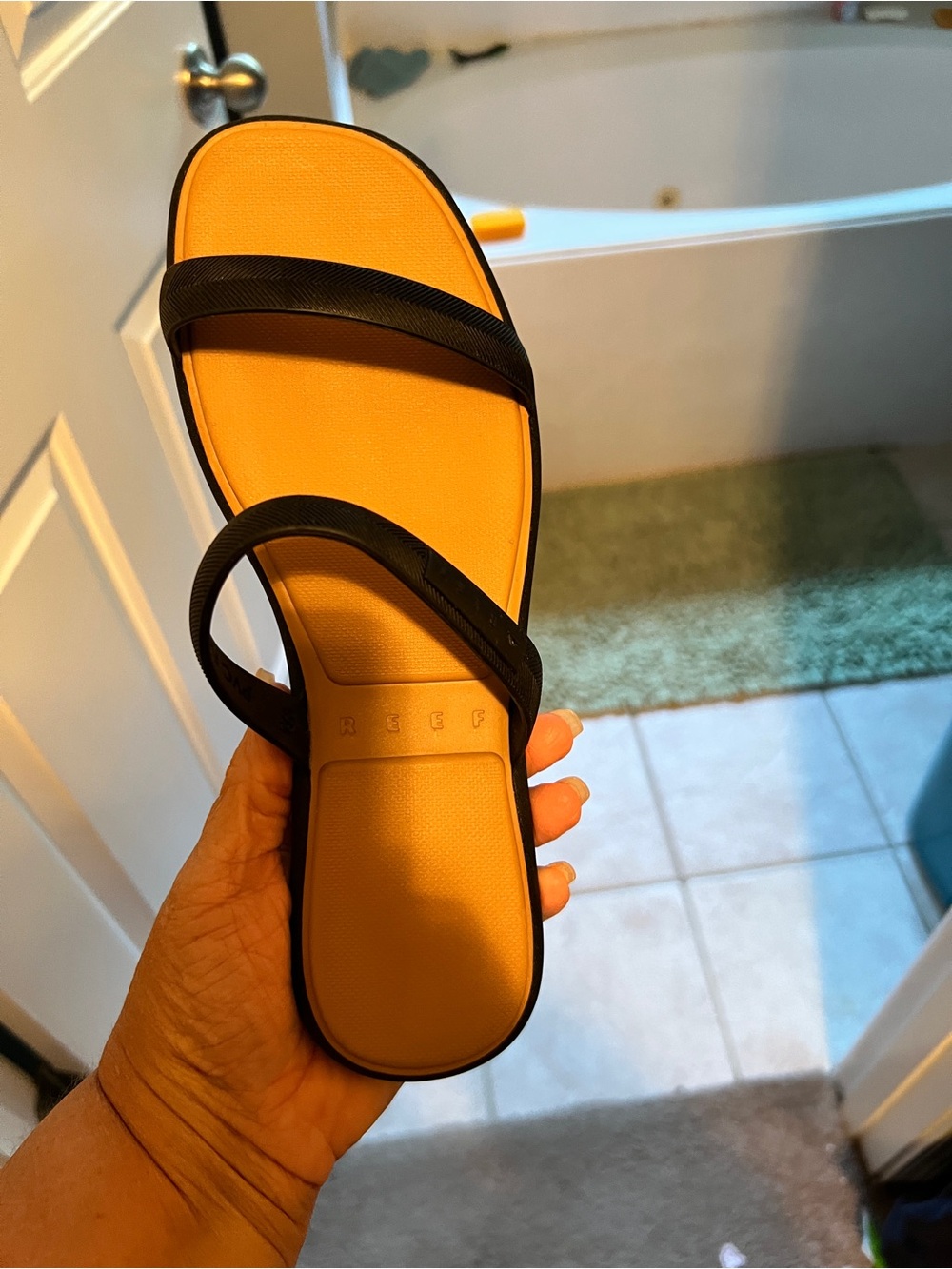 Reef Women’s Black Strap Sandal with Yellow Footbed